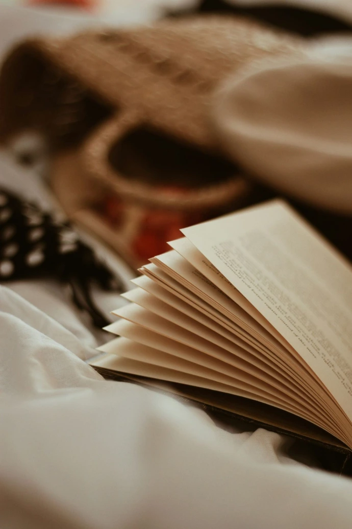 open book and wicker bag